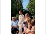 Caitlin walking down aisle with groomsman