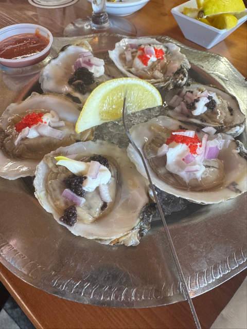 Oysters with sour cream and caviar