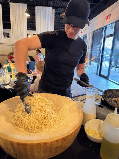 Mixing the pasta around to capture all the cheese